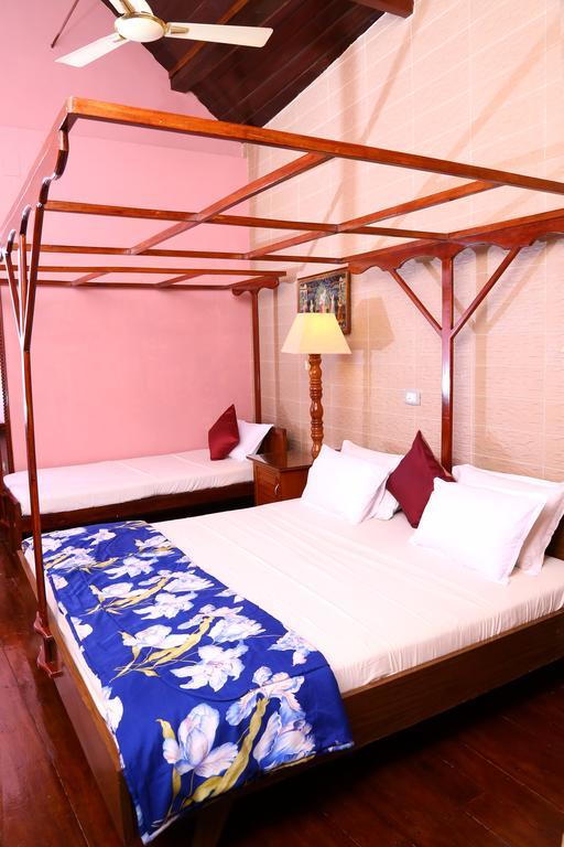 Апартаменти Chiramel Residency Kochi Номер фото